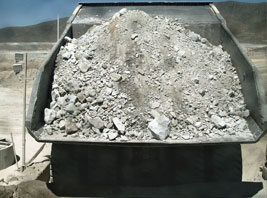 Haul truck bed showing fine content from modified blasting practices