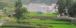Waste dump adjacent to farm land in Southern China