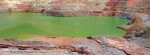 Lake forming in one of the pits - exposed wall rocks include sulfidic materials