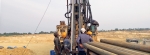 Casing installation in an exploration borehole for aquifer pumping tests