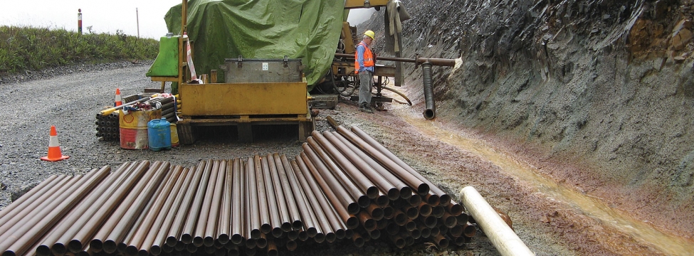 SRK designs program to maintain slope stability and drainage in Ok Tedi copper-gold mine.
