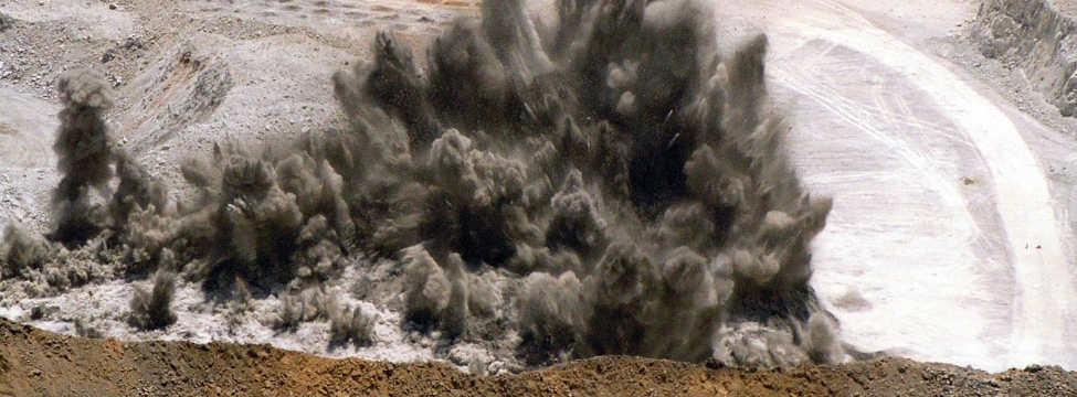 Modifying blasting practices to achieve optimum mill-size for ore extraction.